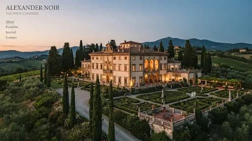 A sprawling, romantic wide shot of a historic Italian villa at dusk, illuminated by soft golden hour light. The architecture is classical and grand, surrounded by manicured gardens and tall cypress trees. The overall mood is nostalgic, archival, and deeply romantic, featuring a sophisticated color palette of warm creams, soft terracottas, and deep greens, consistent with a high-end luxury editorial style.